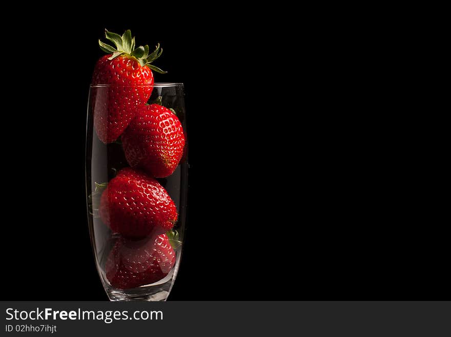 Strawberries In A Glass On Black Background