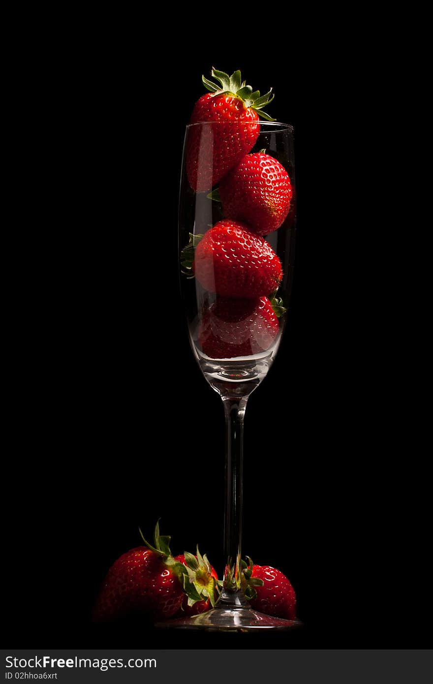 Fresh Strawberries in a glass on black background