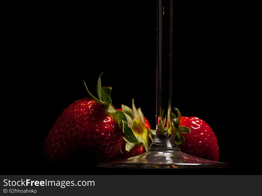 Strawberries In A Glass On Black Background