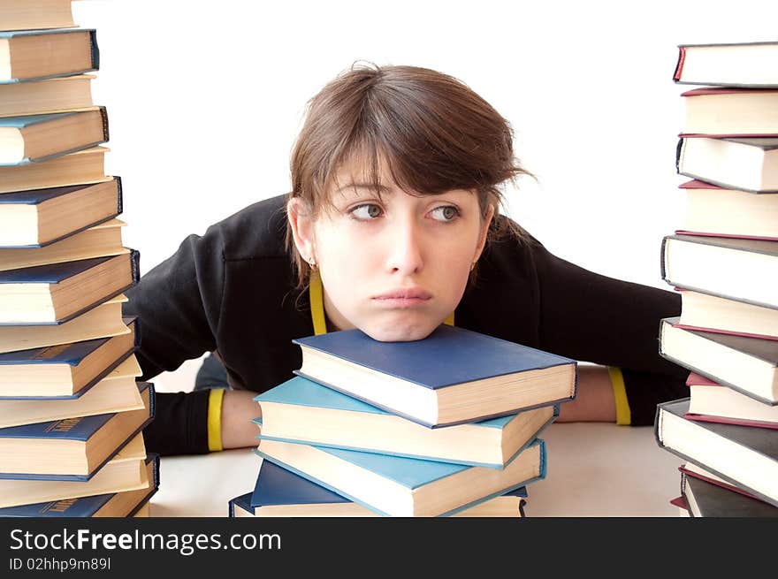 The girl reads books on a white background