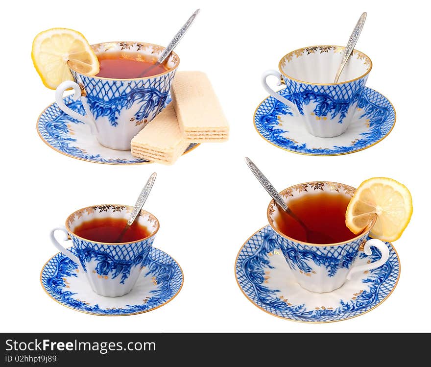 Four cups with tea on a white background. Four cups with tea on a white background