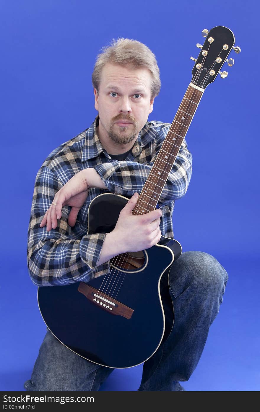 Portrait Of A Man With Guitar