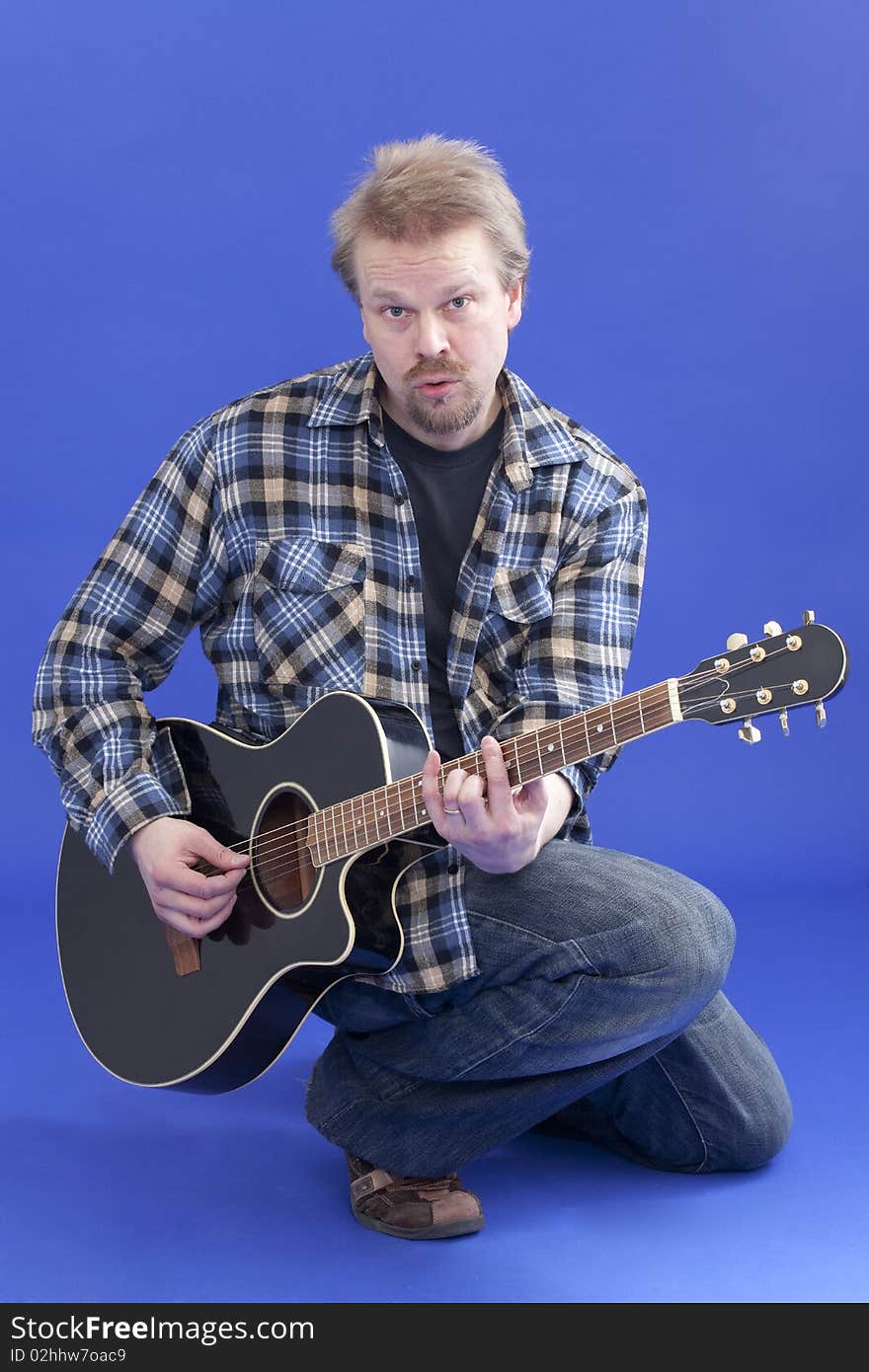 Portrait Of A Man With Guitar