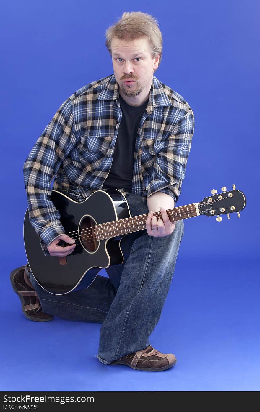 Man Posing With Guitar