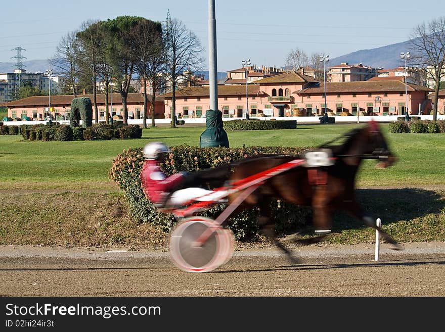 An image of horse trotting cart race competition. An image of horse trotting cart race competition