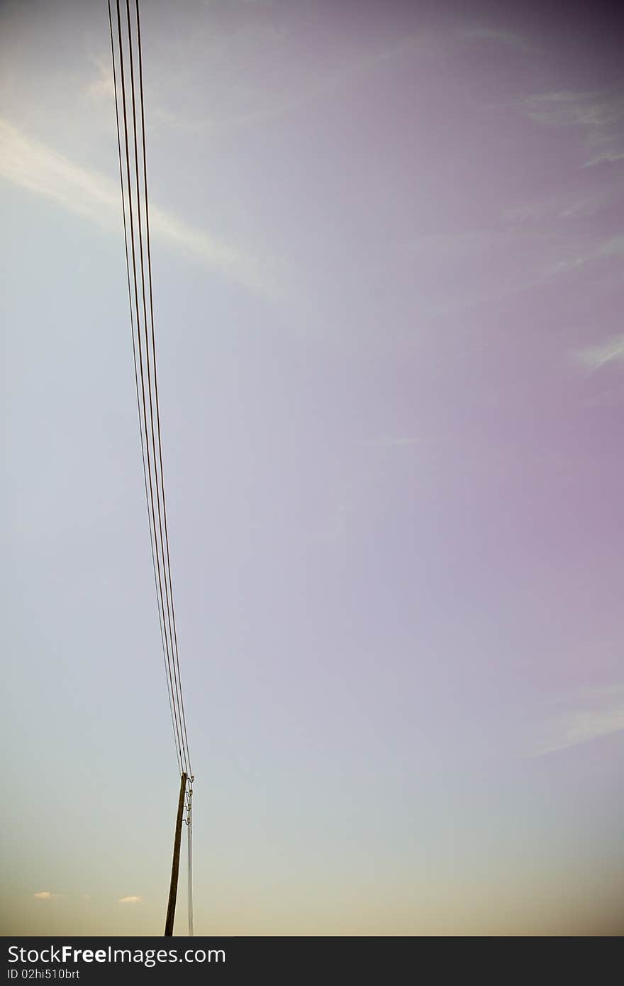 A power line on a purple background. A power line on a purple background