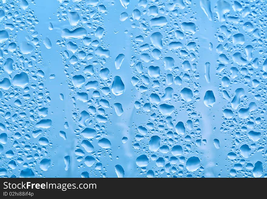 Water bubbles on the window for background. Water bubbles on the window for background