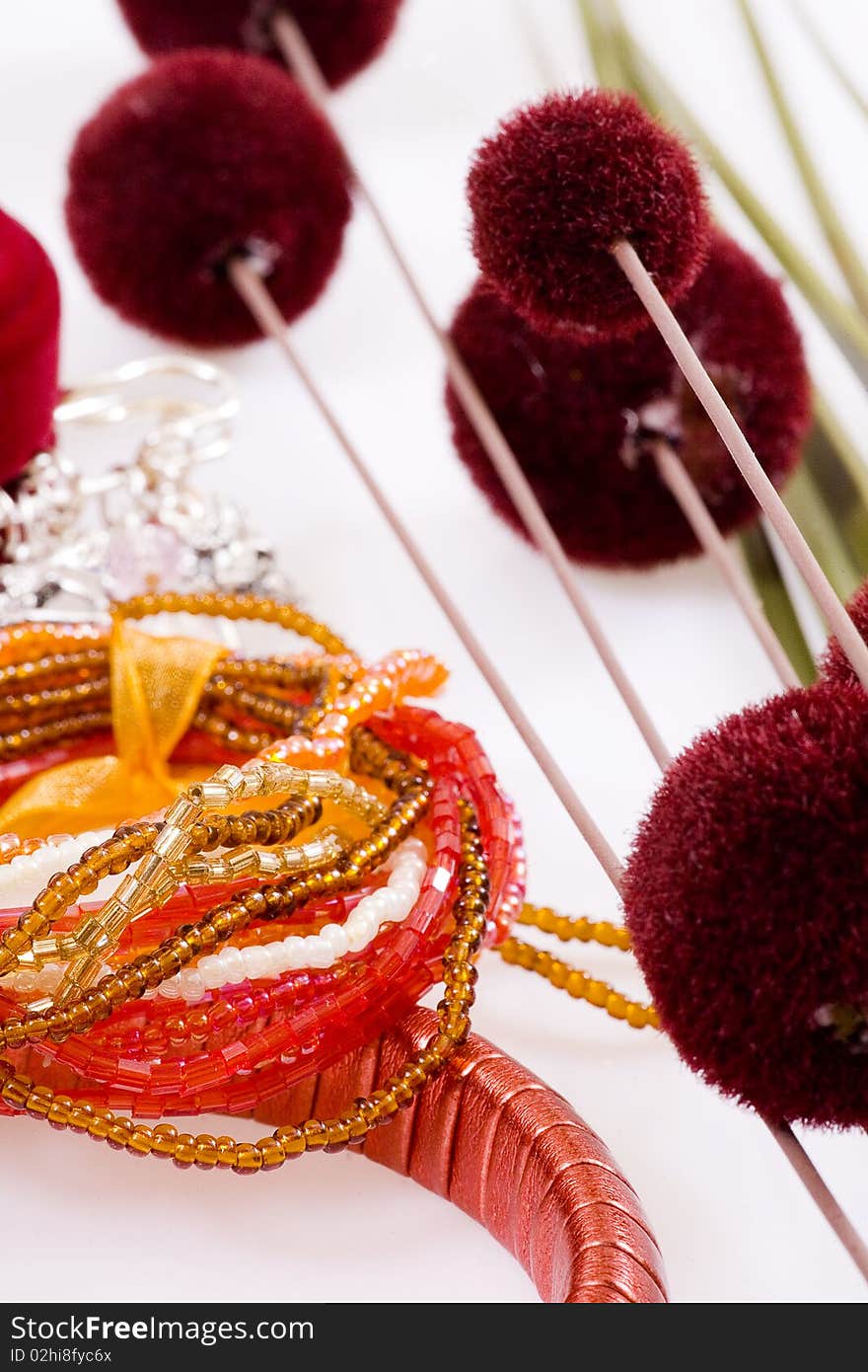 Red bracelet, orange and red flowers