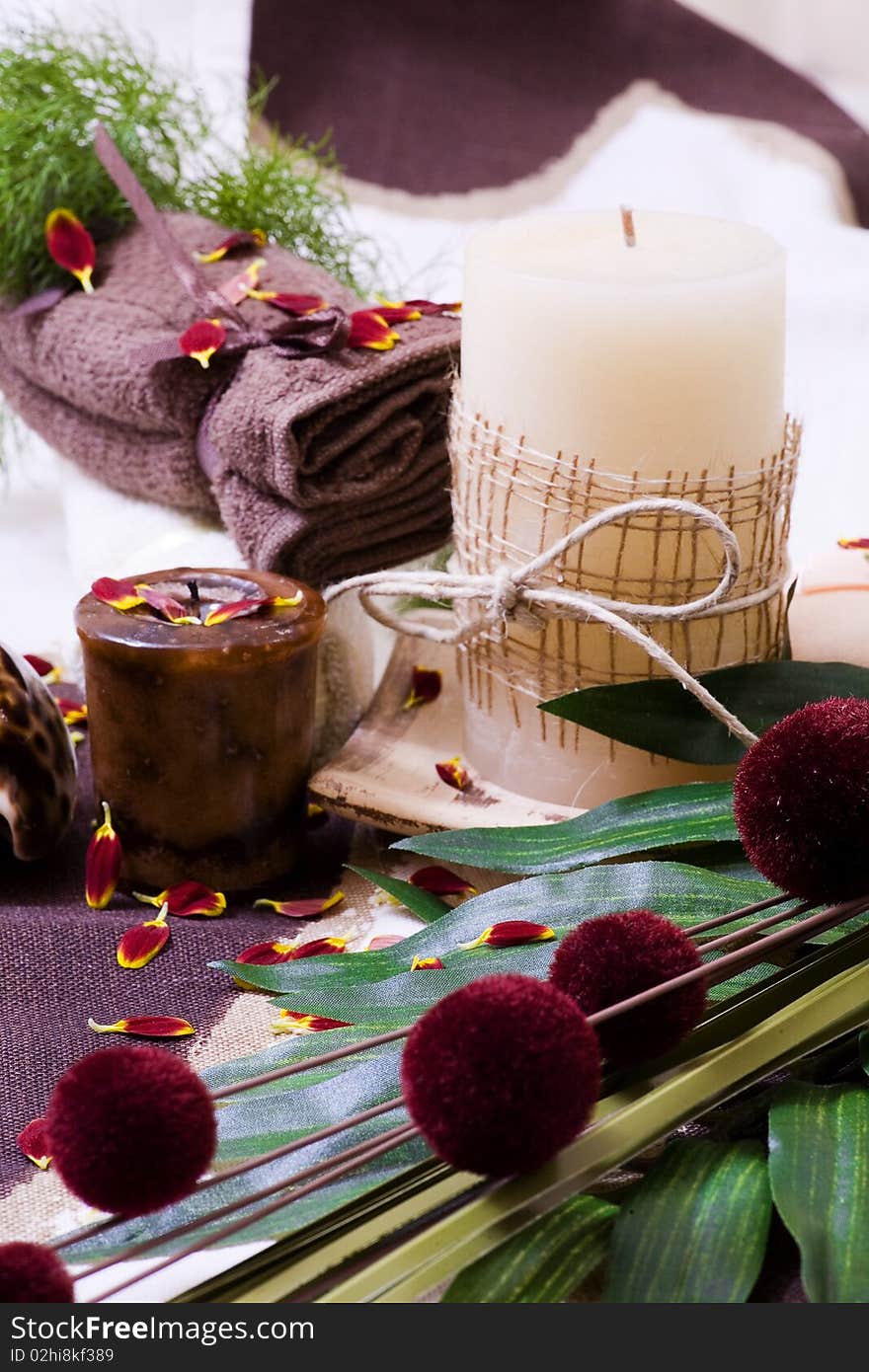 Spa - relax with candles, tower and flower on a white background