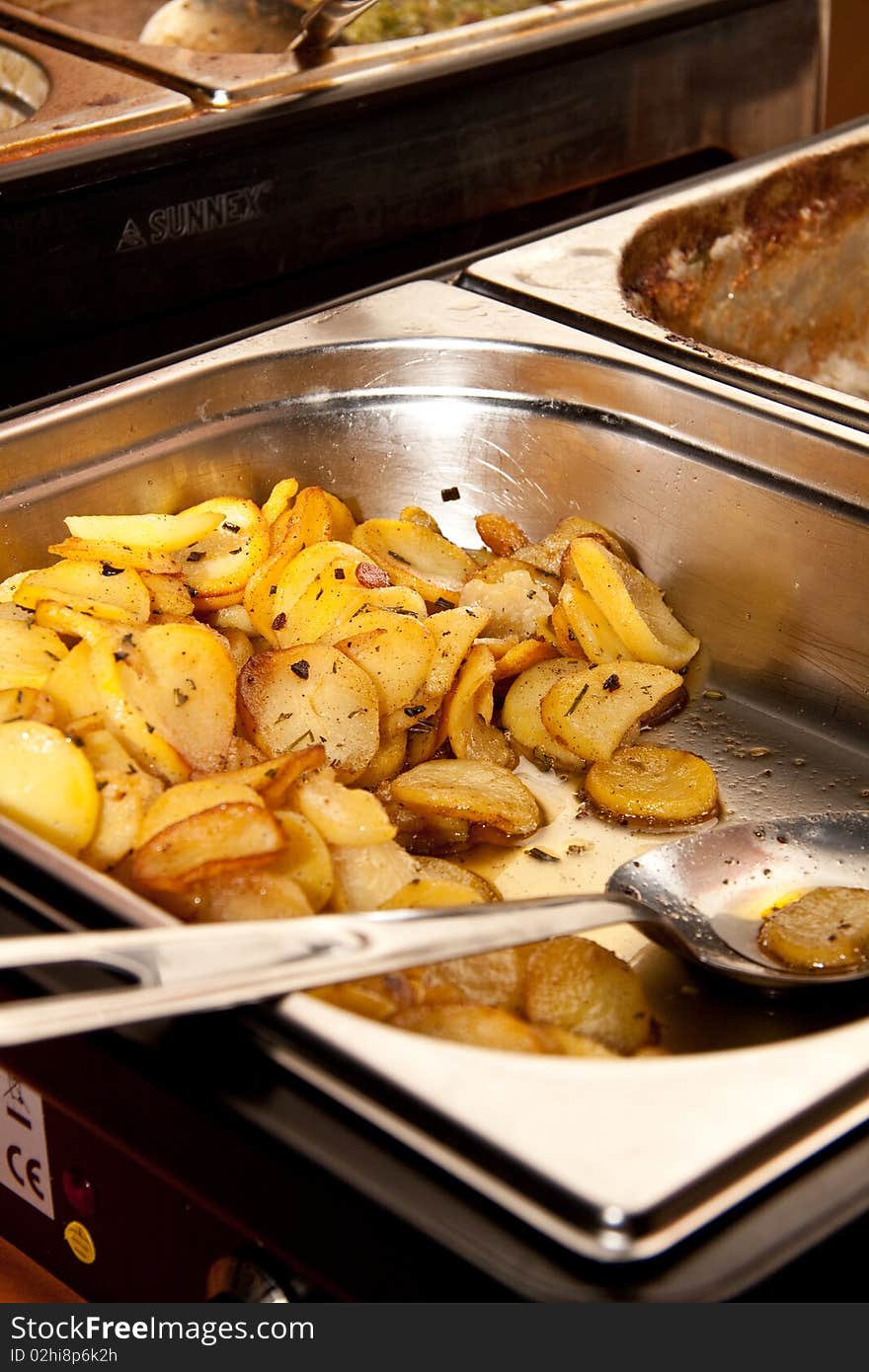 Hot sliced potato from a catering business