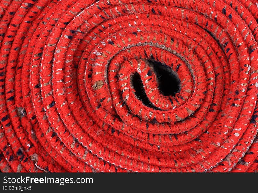 Close up of a red mat  spiral background. Close up of a red mat  spiral background.