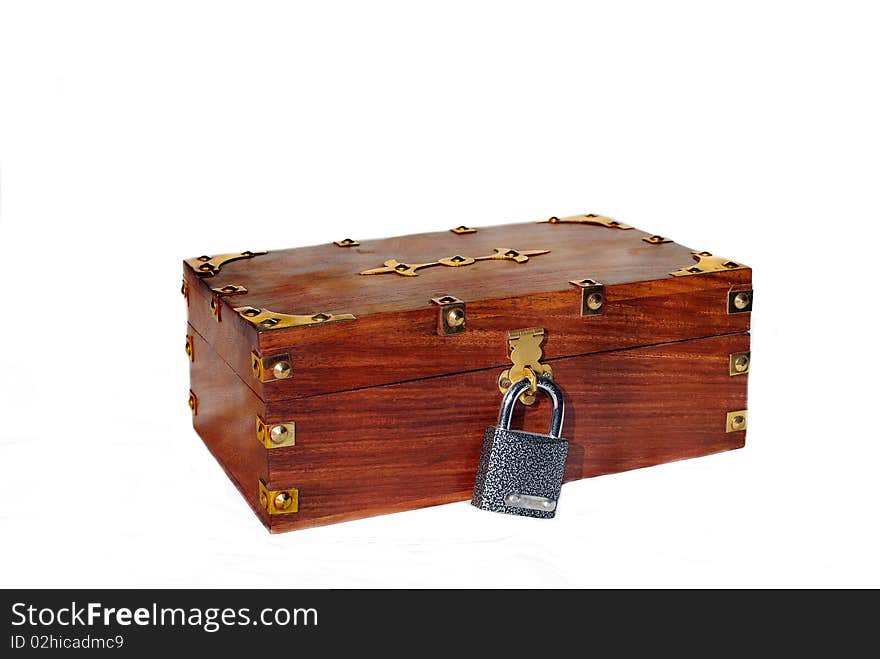 Brown wooden chest (trunk) under lock and key on white. Brown wooden chest (trunk) under lock and key on white