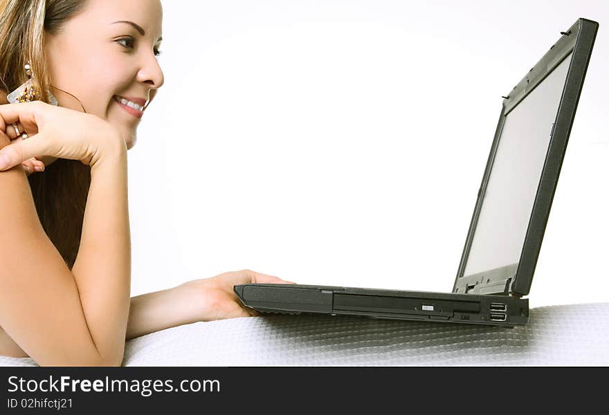 Woman using her laptop over white background