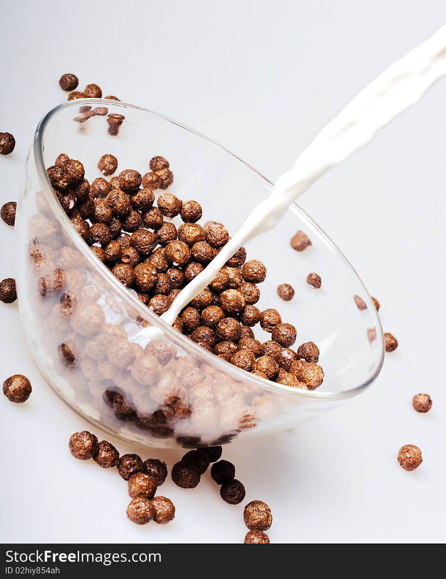 Breakfast - chocolate balls and milk.