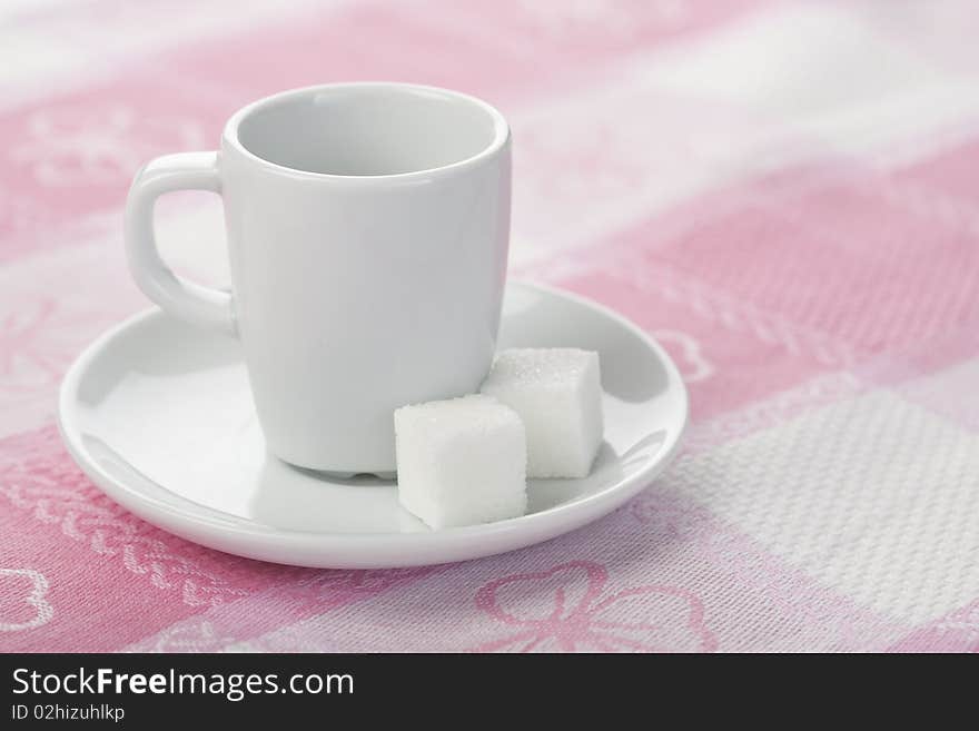 Espresso cup on tablecloth