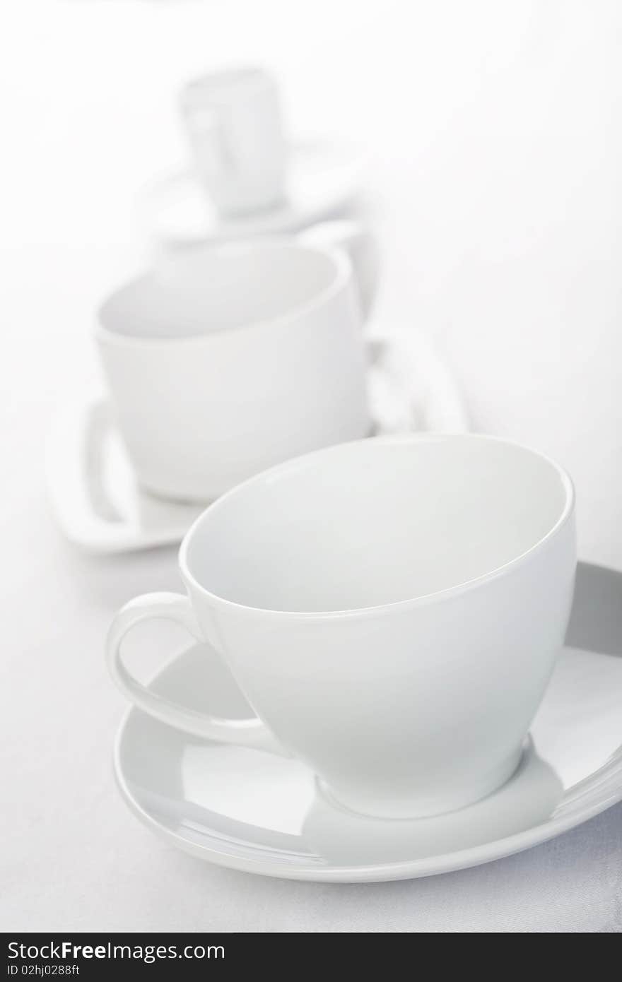 Three Cups On Tablecloth