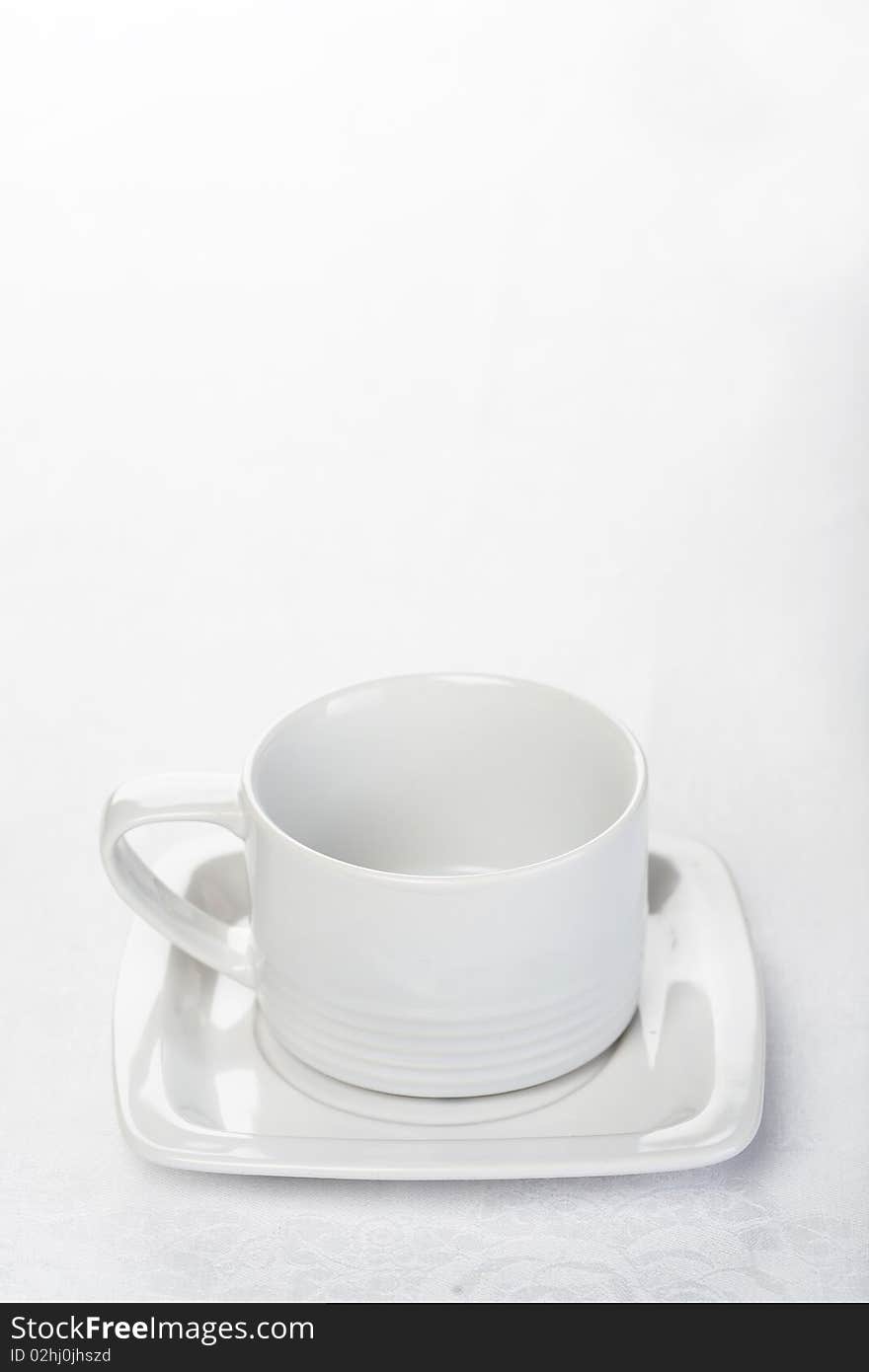 Teacup on white tablecloth