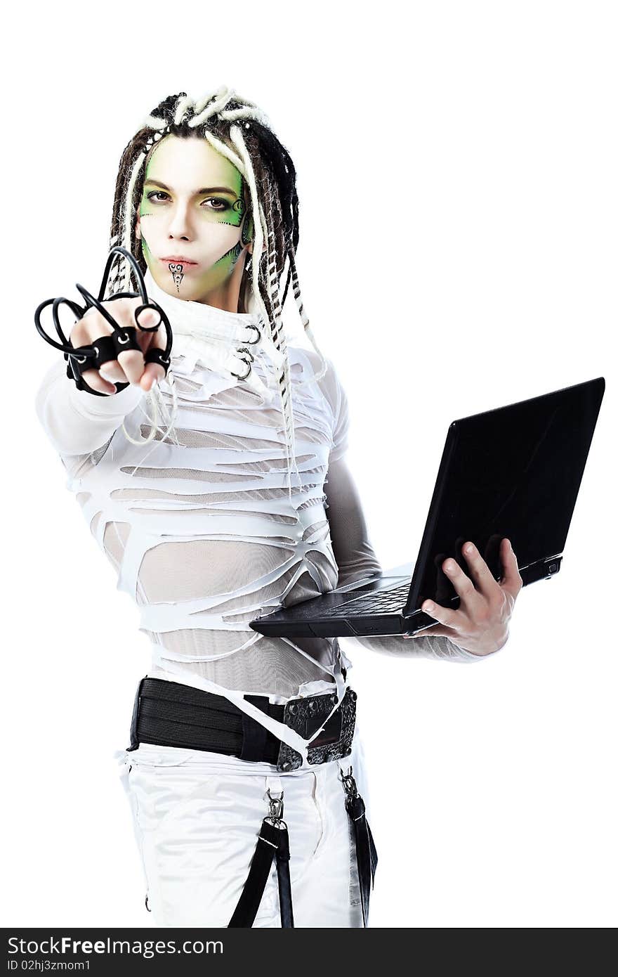 Shot of a futuristic young man with wires holding a laptop. Isolated over white background. Shot of a futuristic young man with wires holding a laptop. Isolated over white background.