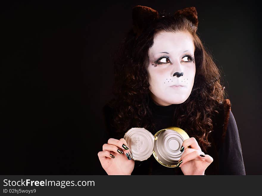 Portrait of a cat-girl with the can. Studio shot. Portrait of a cat-girl with the can. Studio shot.