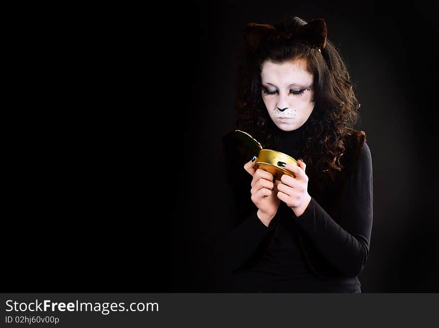 Portrait of a cat-girl with the can. Studio shot. Portrait of a cat-girl with the can. Studio shot.