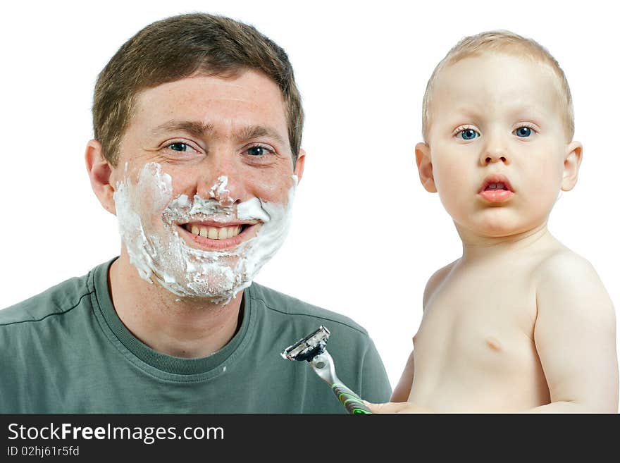 Cute little boy shaving his father - on white background. Cute little boy shaving his father - on white background