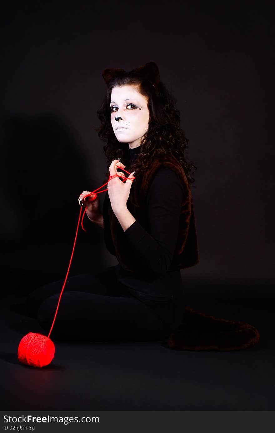 Portrait of a cat-girl with threads ball. Portrait of a cat-girl with threads ball