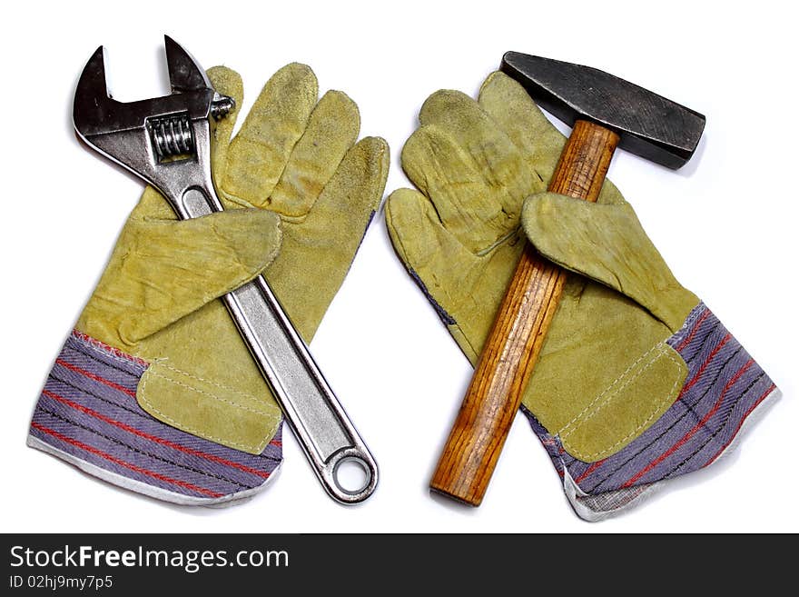 Hammer, wrench and work gloves