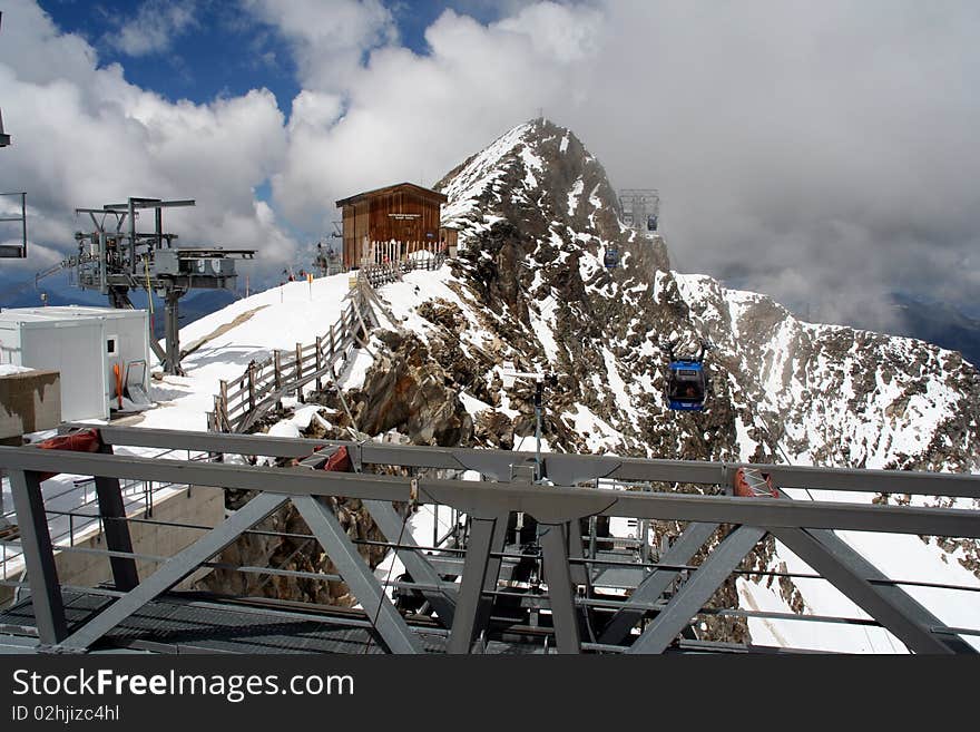 Tourists enjoying snow at 3000 meters altitude in august at Hintertux, Austria. Tourists enjoying snow at 3000 meters altitude in august at Hintertux, Austria