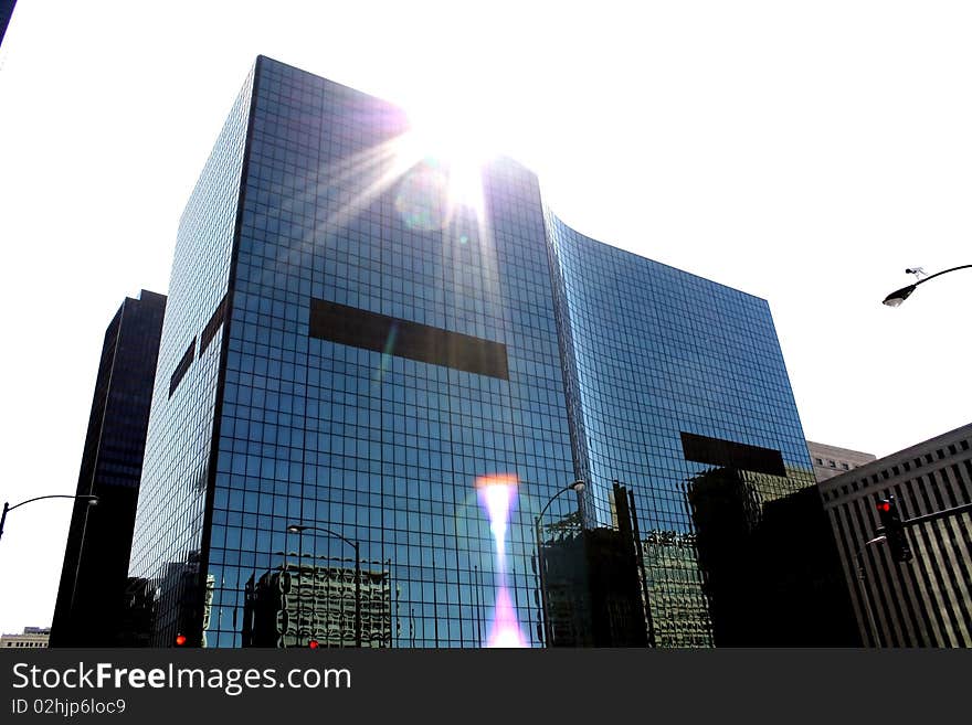 Sun rays diffract the edge of the building. Sun rays diffract the edge of the building