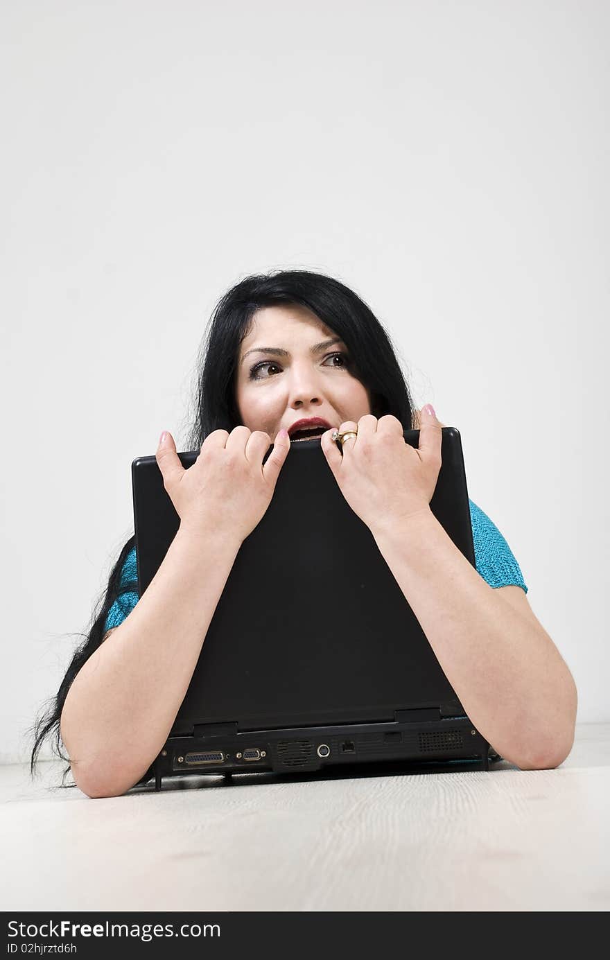 Stressed woman holding laptop