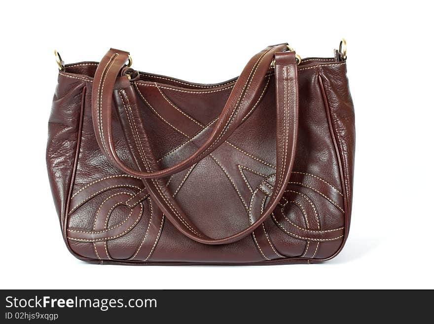 Brown leather woman handbag on the white