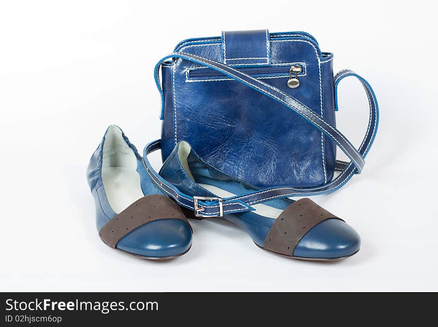 Blue shoes and bag on the white