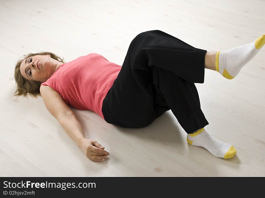 Senior woman relaxing on floor