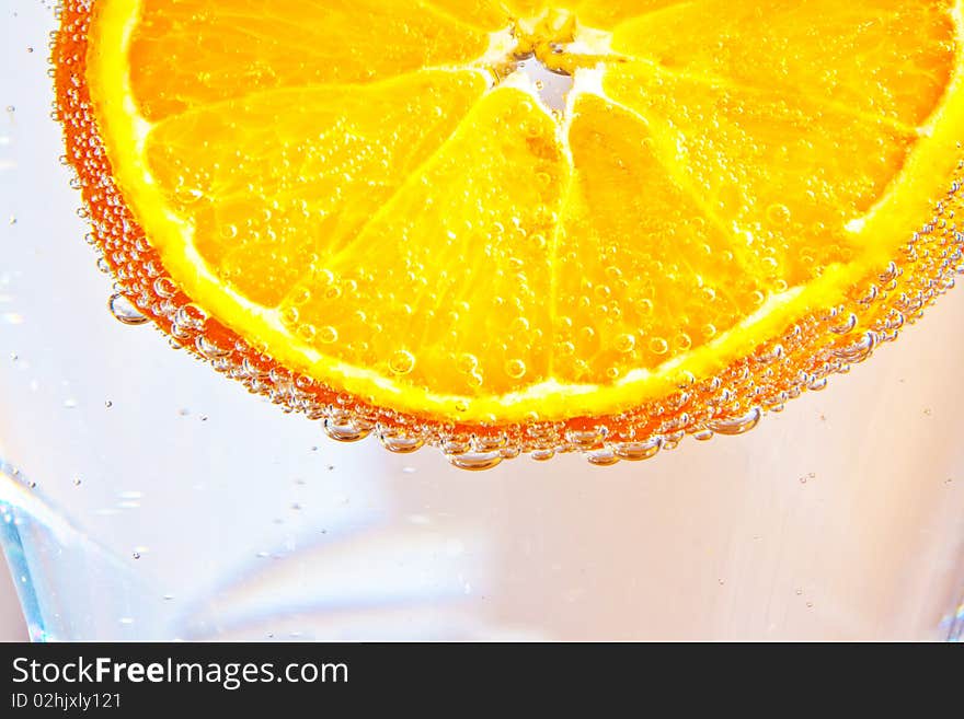 Sliced orange fruits in cocktail glass in detail. Sliced orange fruits in cocktail glass in detail