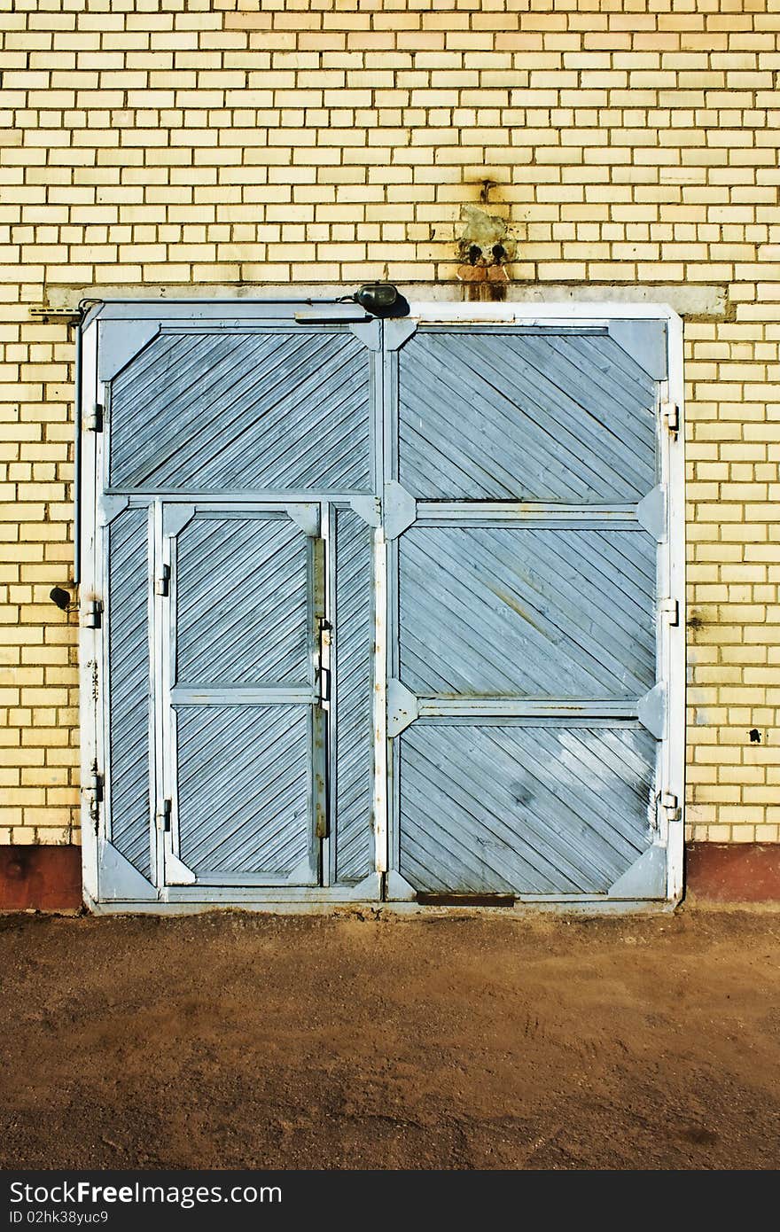 Blue vintage door and the brick wall