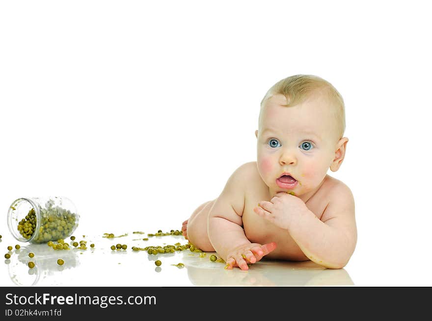 Playing six month baby with jar of pea  on white. Playing six month baby with jar of pea  on white