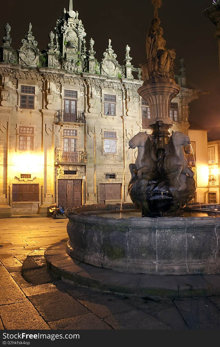 Song writer and guitarrist near Santiago cathedral. Quintana Square. Photo shot at night. Song writer and guitarrist near Santiago cathedral. Quintana Square. Photo shot at night