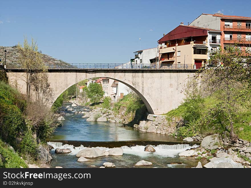 Big bridge with waterfall and green trees. Big bridge with waterfall and green trees