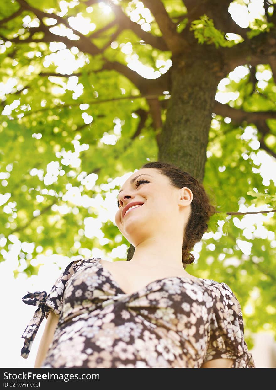 Young woman in park, smiling