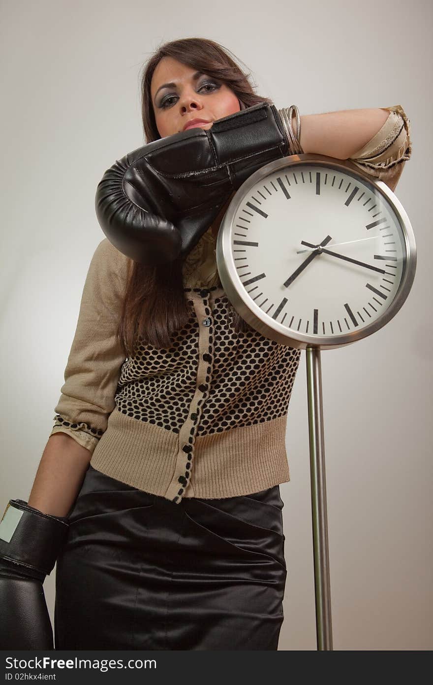 Young woman wearing boxing gloves