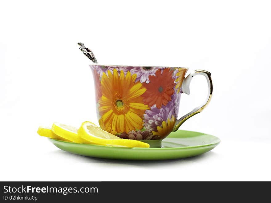 Tea with mint and lemon on a white background