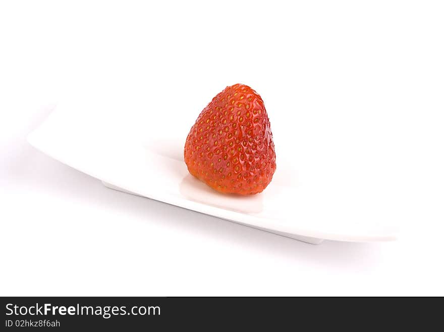 Strawberry on white plate isolated. Strawberry on white plate isolated