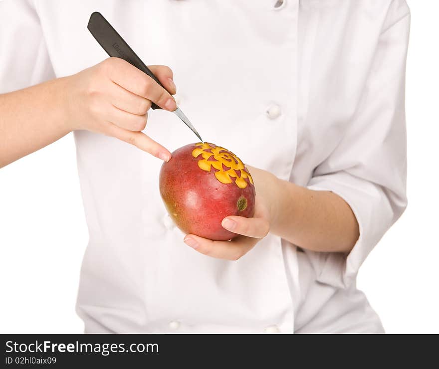 Process of carving a mango isolated on white background