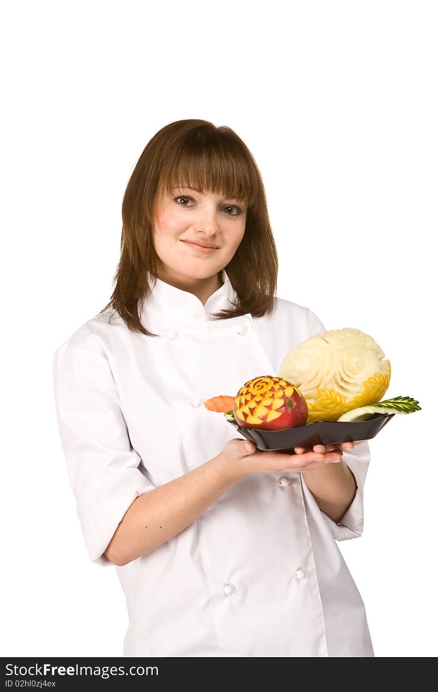 Cook girl holding a plate of fruit isolated on white background