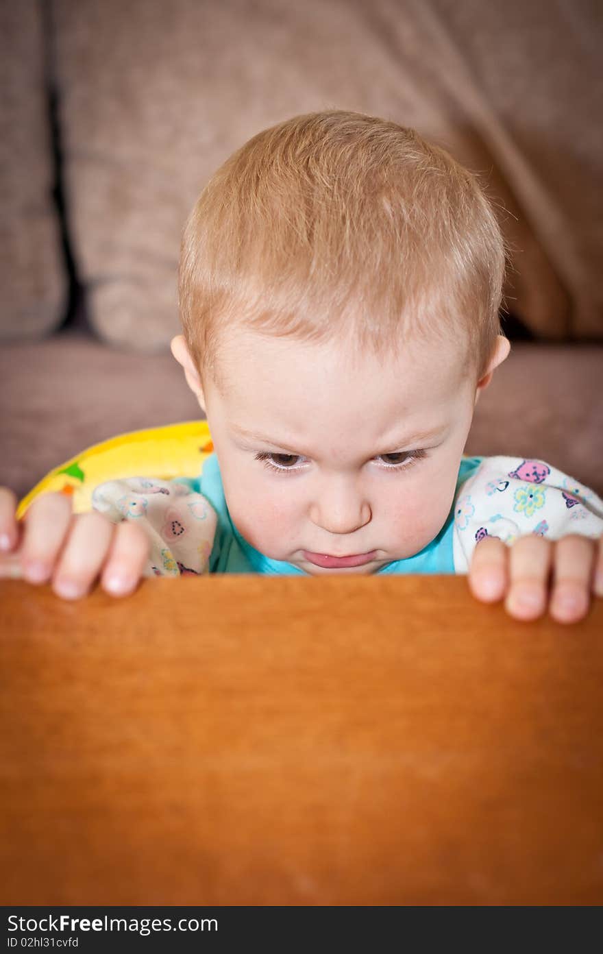 Young Baby Boy And Table