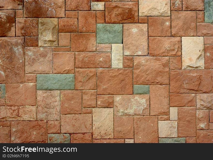 Stone wall in various shades and stains