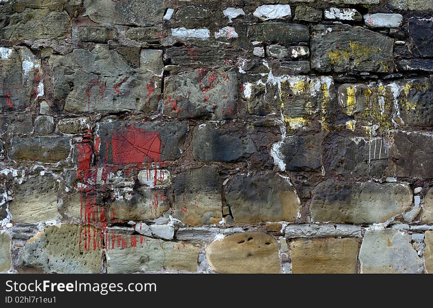 Old stone wall and stained with various colors. Old stone wall and stained with various colors