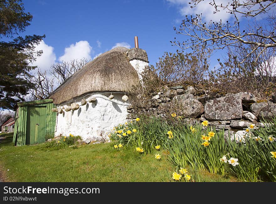 Thatched cottage in Highlands, Scotland. Vibrance increased. Thatched cottage in Highlands, Scotland. Vibrance increased.