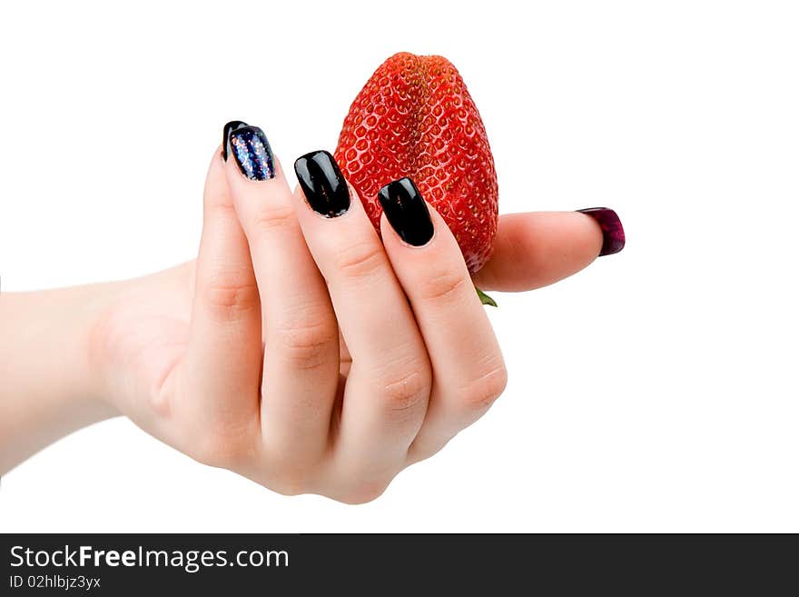 Strawberry in a female hand, it is isolated on a white background