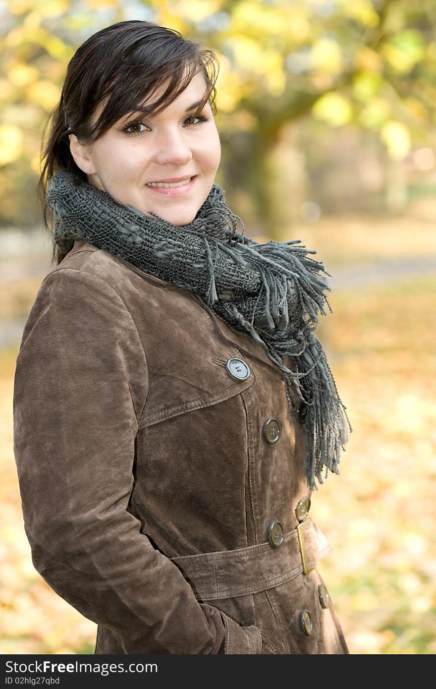 Attractive brunette woman happy at park. Attractive brunette woman happy at park